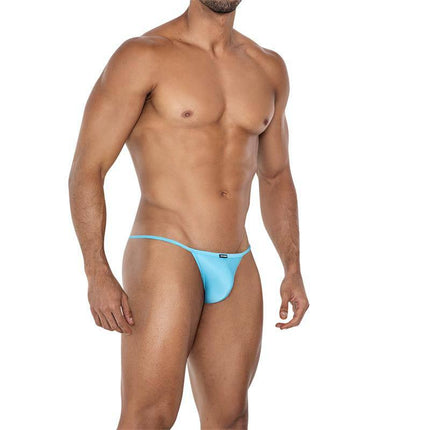 Model wearing C4MSPX16 Tanga Kini Turquoise swim brief, showcasing vibrant color and comfortable fit.