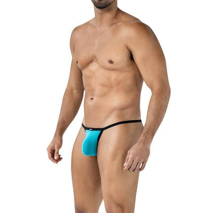 C4MSPX17 Mini Tanga Kini Turquoise thong with black trim for men, showcasing bold style and comfort, worn by a model.