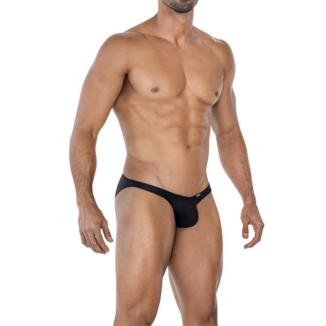 Model wearing C4MSPXBUL01 Low Rise Bulge Brief Black, showcasing a sleek design and comfortable fit from the CUT4MEN collection.