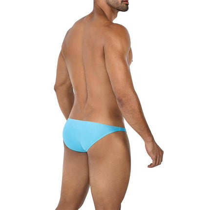 Man wearing C4MSPXBUL01 Low Rise Bulge Brief Turquoise from CUT4MEN collection, showcasing back view of turquoise brief for men.