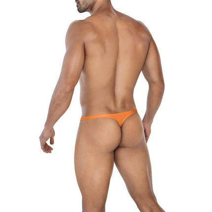 Rear view of a model wearing C4MSPXBUL02 Bulge Thong Copper Spring, showcasing a bold and comfortable design.