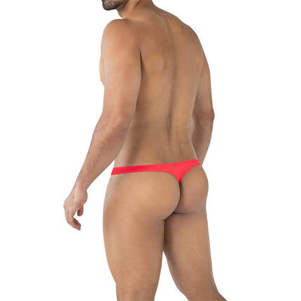 Model wearing C4MSPXBUL02 String Bulge Crimson Red thong showcasing minimalist back cut and vibrant color.