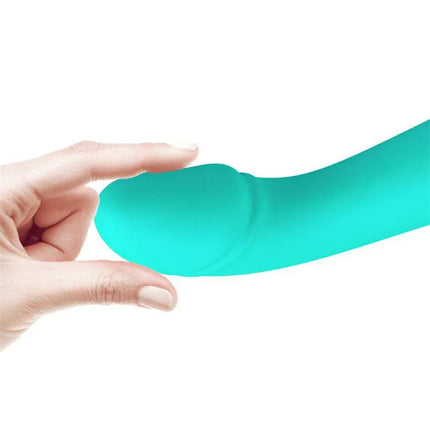 Cetus Vibrator Green showing flexible silicone tip held by fingers for detail on texture and design.