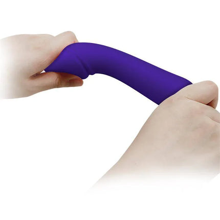Hands holding and flexing the Cetus Vibrator Purple, showing its ultra-soft silicone texture and flexibility.