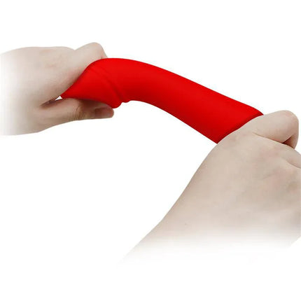 Hands flexing a red Cetus Vibrator Red, showcasing its flexibility and premium silicone design.