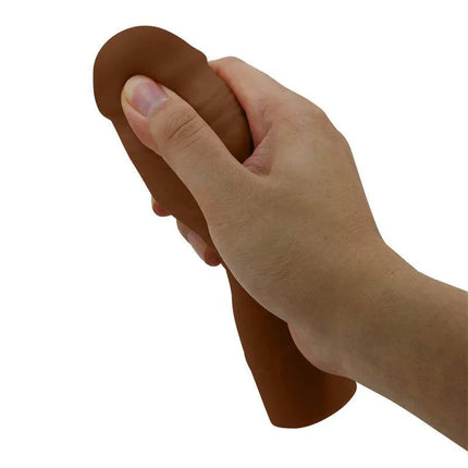 Hand holding Chane Extended Penis Sleeve for enhanced pleasure and performance
