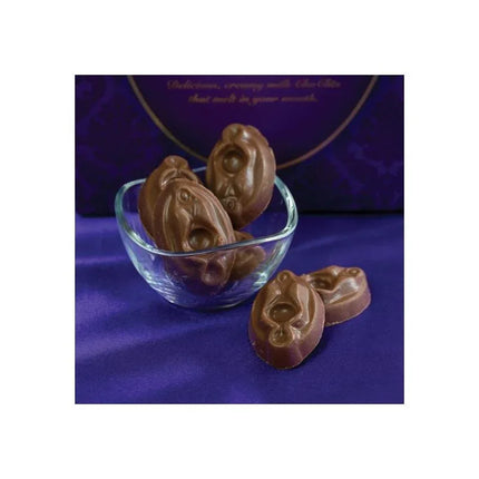 ChoClits milk chocolates clitoris-shaped arranged in glass bowl, perfect for playful gifts or bachelor parties.