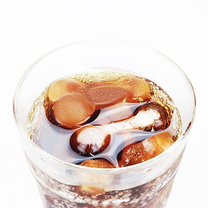 Drink with ice cubes made from Chocolate or Ice Cubes Silicone Mold Penis Shaped, showcasing playful party entertainment.