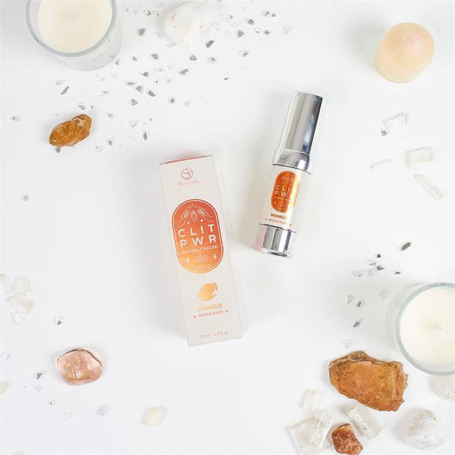 "Clit Pwr Clítoris stimulating balm Mango 15 ml bottle and packaging with crystals and candles"