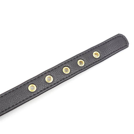 Close-up of the Collar with Bow and Rattle 44 cm Black/Red showing adjustable holes and gold accents.