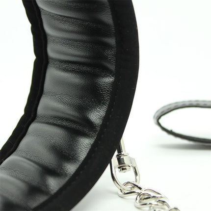 Close-up of a Collar with Metal Leash and Pedded Interior Black, featuring padded lining and detachable chain for comfort and control.