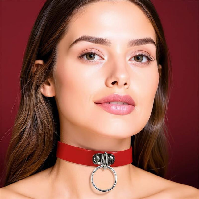 Woman wearing Collar with Ring Vegan Leather One Size, red choker highlighting bold ring, stylish and skin-friendly accessory by Cinderella.