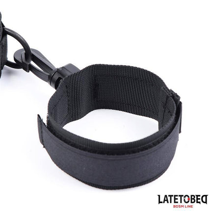 Collar with Wrist Restraints Nylon - Black nylon collar with integrated wrist restraint, durable design for couples' intimate play.