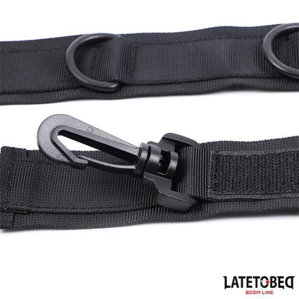 Black Collar with Wrist Restraints Nylon featuring sleek design and sturdy hook for intimate play, ideal for couples exploring power dynamics.