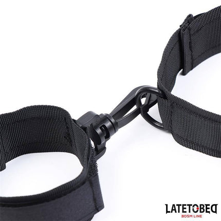 Collar with Wrist Restraints Nylon in black, featuring durable and stylish design for intimate play. Lightweight, comfortable, and adjustable.
