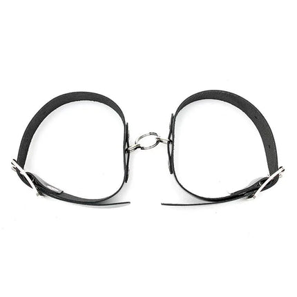 Cuffs Adjustable black leather bondage cuffs with buckles for secure and comfortable restraint in intimate play, featuring durable craftsmanship.