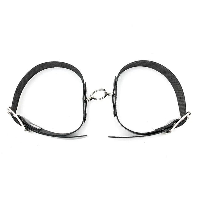 Cuffs Adjustable black leather bondage cuffs with buckles for secure and comfortable restraint in intimate play, featuring durable craftsmanship.