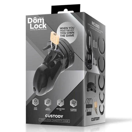 Custody Chastity Cage for Control and Submission product packaging by Domlock, featuring a black penis cage with lock and key.