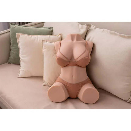 Dania Torso with Thrusting 19.5 cm on sofa displaying realistic design and lifelike texture for enhanced solo or shared pleasure.