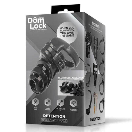Domlock packaging for Detention Chastity Cage for Prince Albert Piercing, showcasing accessories and key features.