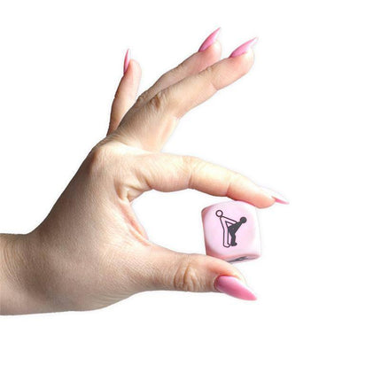 Hand holding Dice Kamasutra Pictograms 6 Postures 25 mm with playful pose illustration.