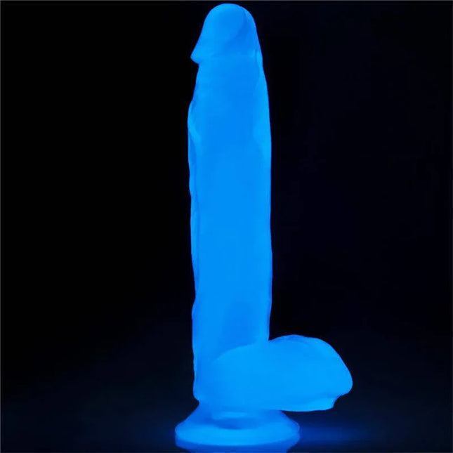Dildo Lumino 10 Blue Light glowing in the dark, showcasing its ergonomic and realistic design for enhanced sensory experience.