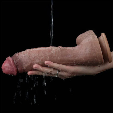 Dildo Nature 10.5 Dual Layer by Love Toy King in a realistic design, crafted from platinum double-density silicone, held under water for cleaning.