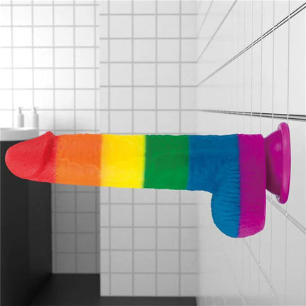 Dildo Prider 9 Liquid Silicone LGBT rainbow pride dildo with suction cup, medical-grade material in a bathroom setting.
