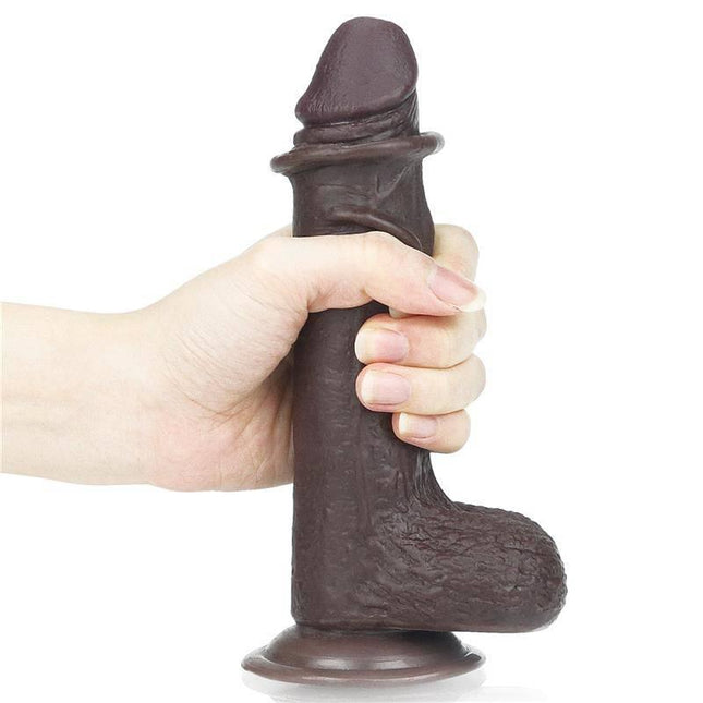 Dildo Sliding 7 Black held in hand, showcasing lifelike double-layer material and flexible design with dual-density technology.