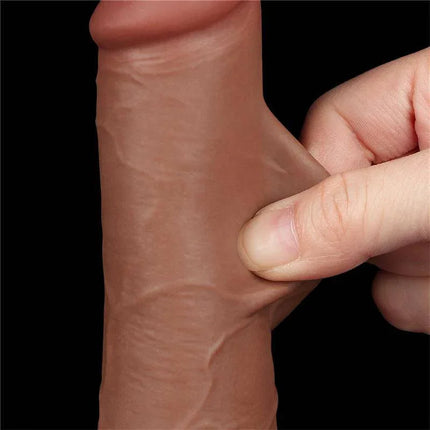 Close-up of Dildo Sliding Skin 7.5 Brown showing flexible dual-layer TPE texture held between fingers for lifelike sensation.