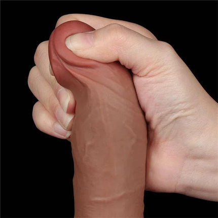 Dildo Sliding Skin 8 Brown showcasing realistic dual-density flexibility in hand