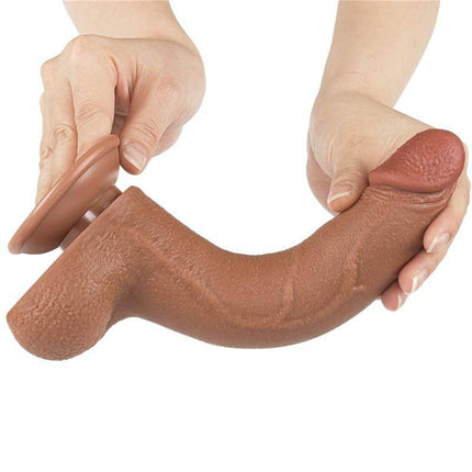 Close-up of hands holding Dildo Sliding Skin 8.5 Brown showcasing flexibility and realistic texture.
