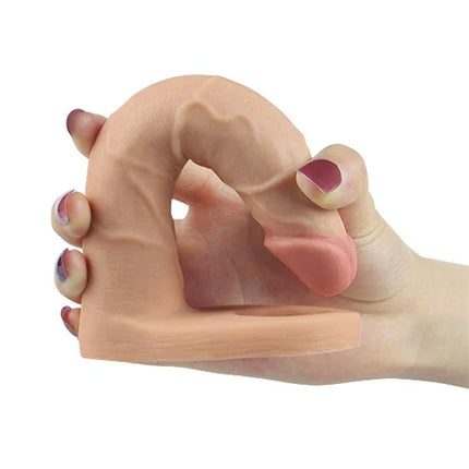 Dildo The Ultra Soft Double 7 Flesh in hand showcasing flexibility and realistic texture, made from soft TPE material.