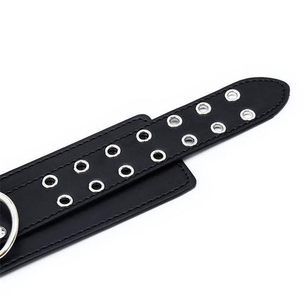 Close-up of Double Buckle Adjustable handcuffs with metal eyelets from Latetobed’s BDSM line.