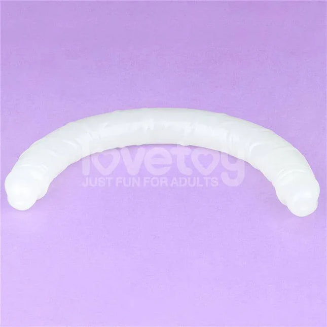 Double dildo Lumino Blue Light 18.5 glow-in-the-dark dual-ended pleasure toy on purple background