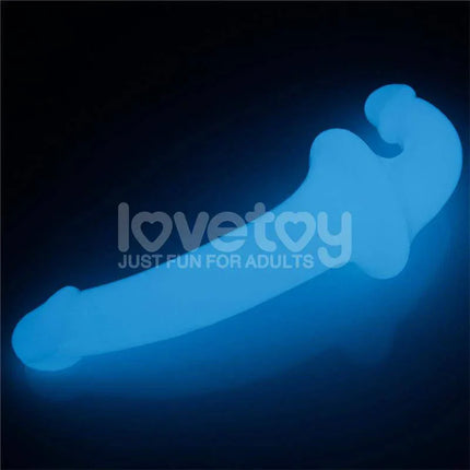 Double dildo Lumino Play Blue Light 10.5 glowing in the dark, showcasing double-ended design for shared or solo use.