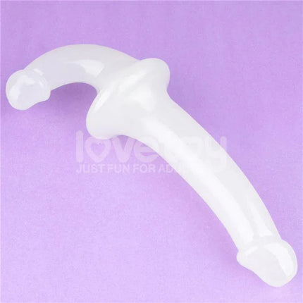 Double dildo Lumino Play Blue Light 10.5, glow-in-the-dark design, curved shape, displayed on a purple background, perfect for intimate play.