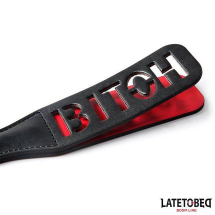 Double Layers Paddle BITCH 32 cm BDSM item with bold design, showcasing two-layer PU construction for impact play.
