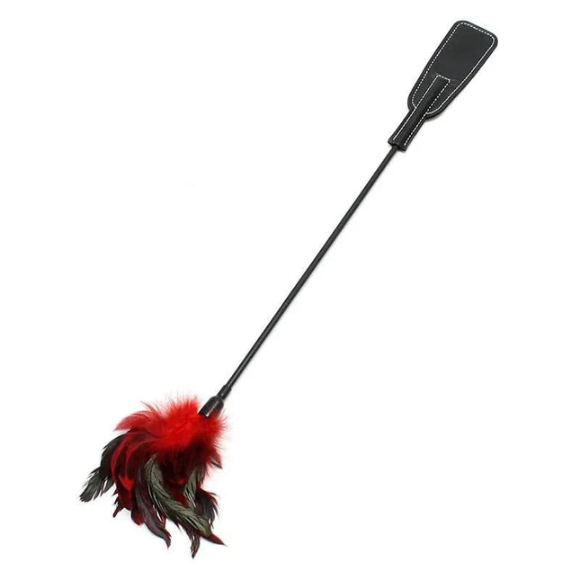 Double Pleasure Whip with dual-sided design featuring paddle and feather stimulator for sensory play.