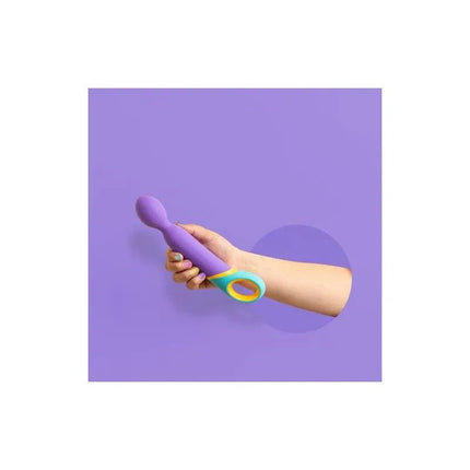 Person holding Double Stimulation Base USB, a colorful vibrator designed for internal and external pleasure with flexible head.