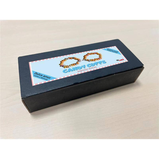 Box with candy handcuffs on packaging labeled 'Candy Cuffs', perfect for playful and sweet moments. Focus keyword: Edible Hancuffs.