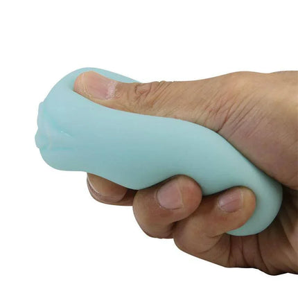 Hand compressing Egg Masturbator Blue for Enhanced Pleasure, showcasing its super stretchy TPR material, blue exterior.