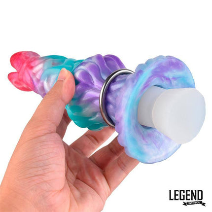 Hand holding Eggryphon Ovipositor Dildo Liquid Silicone 20 cm in colorful design with hollow top and manual pump for dynamic stimulation