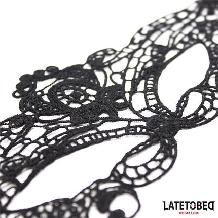 Elegant Mask Black close-up, showcasing intricate lace pattern enhancing style and elegance, perfect for various outfits.