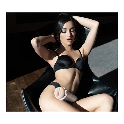 Emily Willis Squirt Vagina Masturbator from Fleshlight on chair with woman in black lingerie
