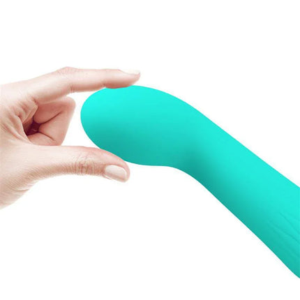 Faun Vibrator Green with soft silicone and curved tip for G-spot stimulation, shown in a hand for flexibility demonstration.