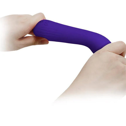 Faun Vibrator Purple being held and flexed for ergonomic demonstration