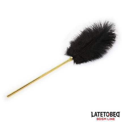 Feather Tickler 41 cm with gold-tone handle, designed for sensory play and heightened arousal in intimate settings.