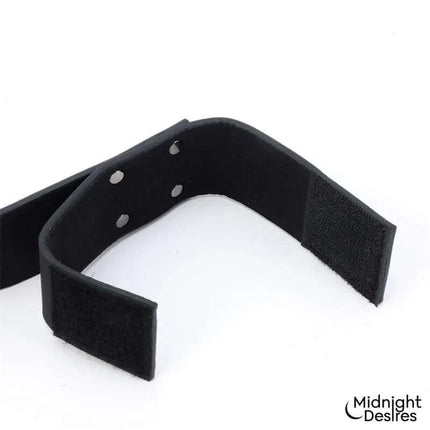 Close-up of Flexible Bondage Bar with vegan leather cuffs for comfortable restraint.