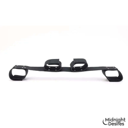 Flexible Bondage Bar by Midnight Desires, featuring vegan leather and sturdy hardware for versatile restraint options.